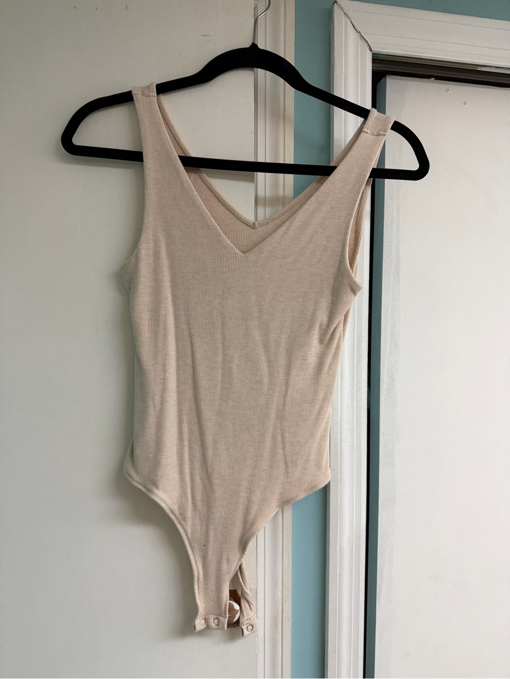 Sleeveless V-Neck Ribbed Bodysuit in Light Beige